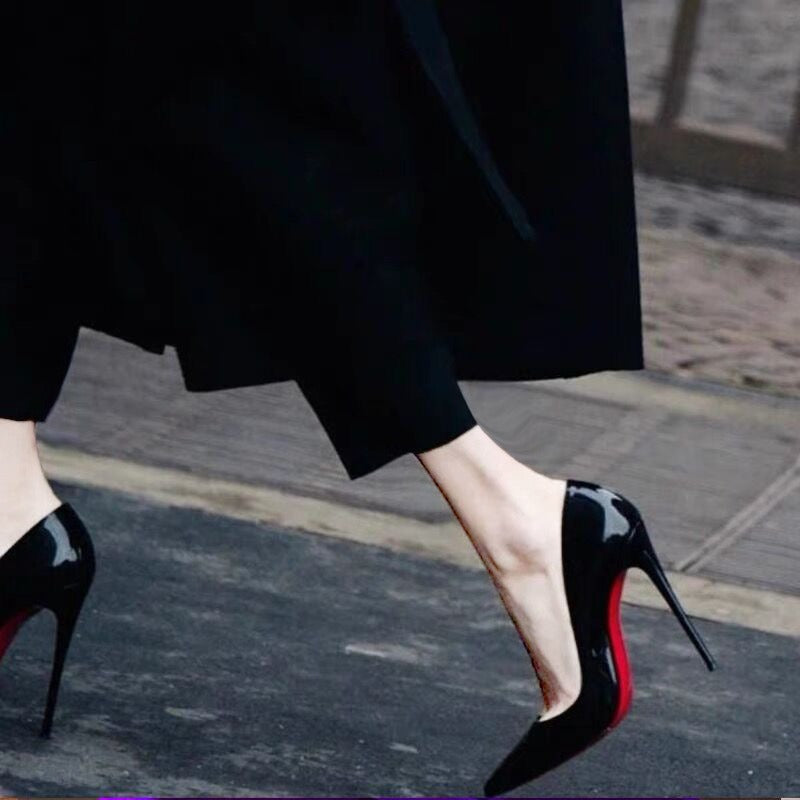 Black shoes with a red base and high heels