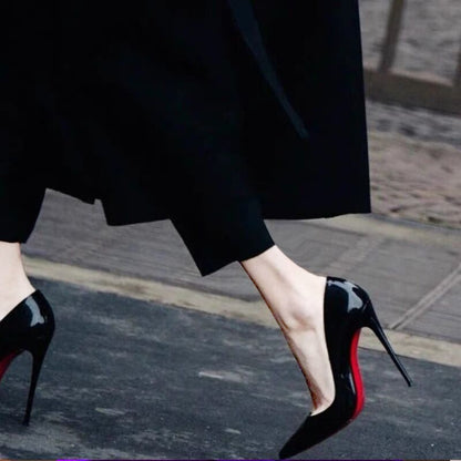 Black shoes with a red base and high heels