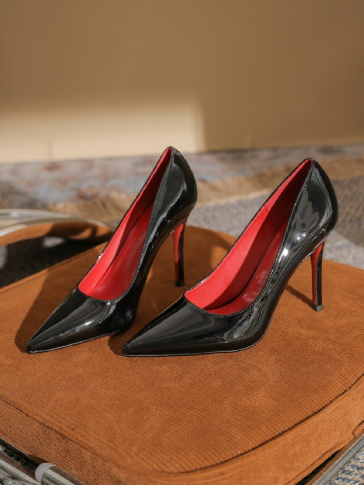 Black shoes with a red base and high heels